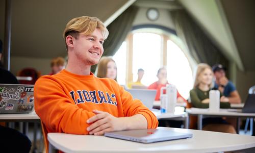 A student smiling on campus